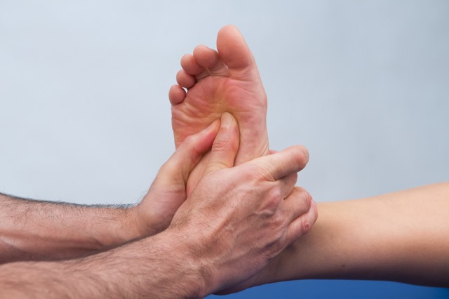Manual therapy (massage) to the plantar side of the foot. Permission: Joseph E. Muscolino.